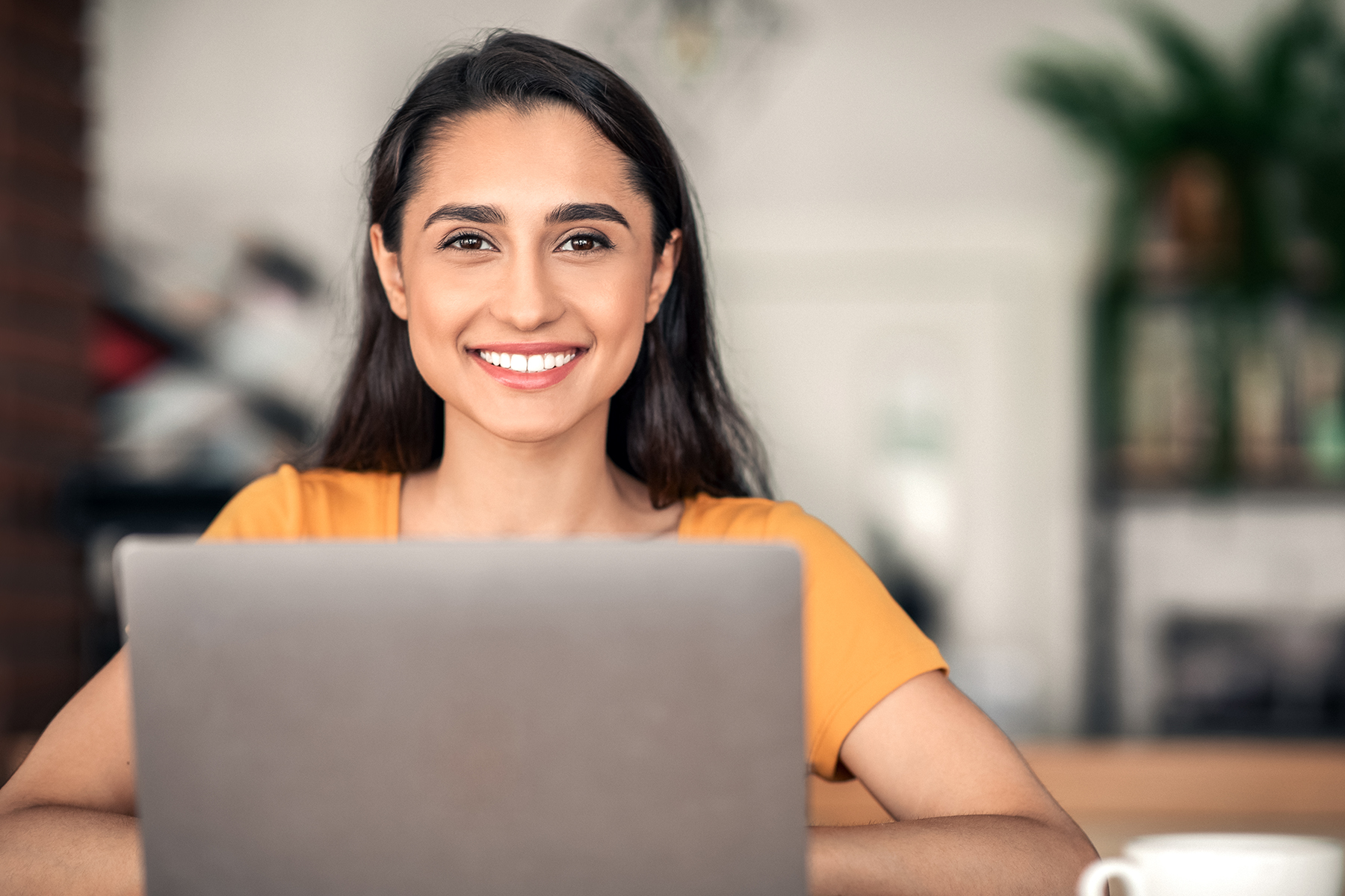 Helpful representative woman on laptop