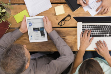 Business team working together viewed from overhead