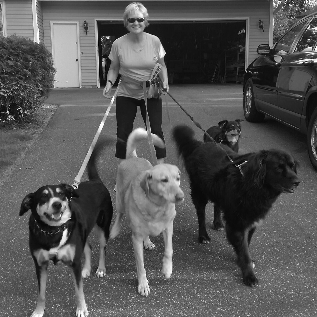 mary with her four dogs