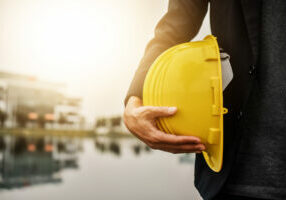 Worker Architecture Engineer hold hard hat helmet safety  for construction